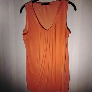 Orange shell blouse.
